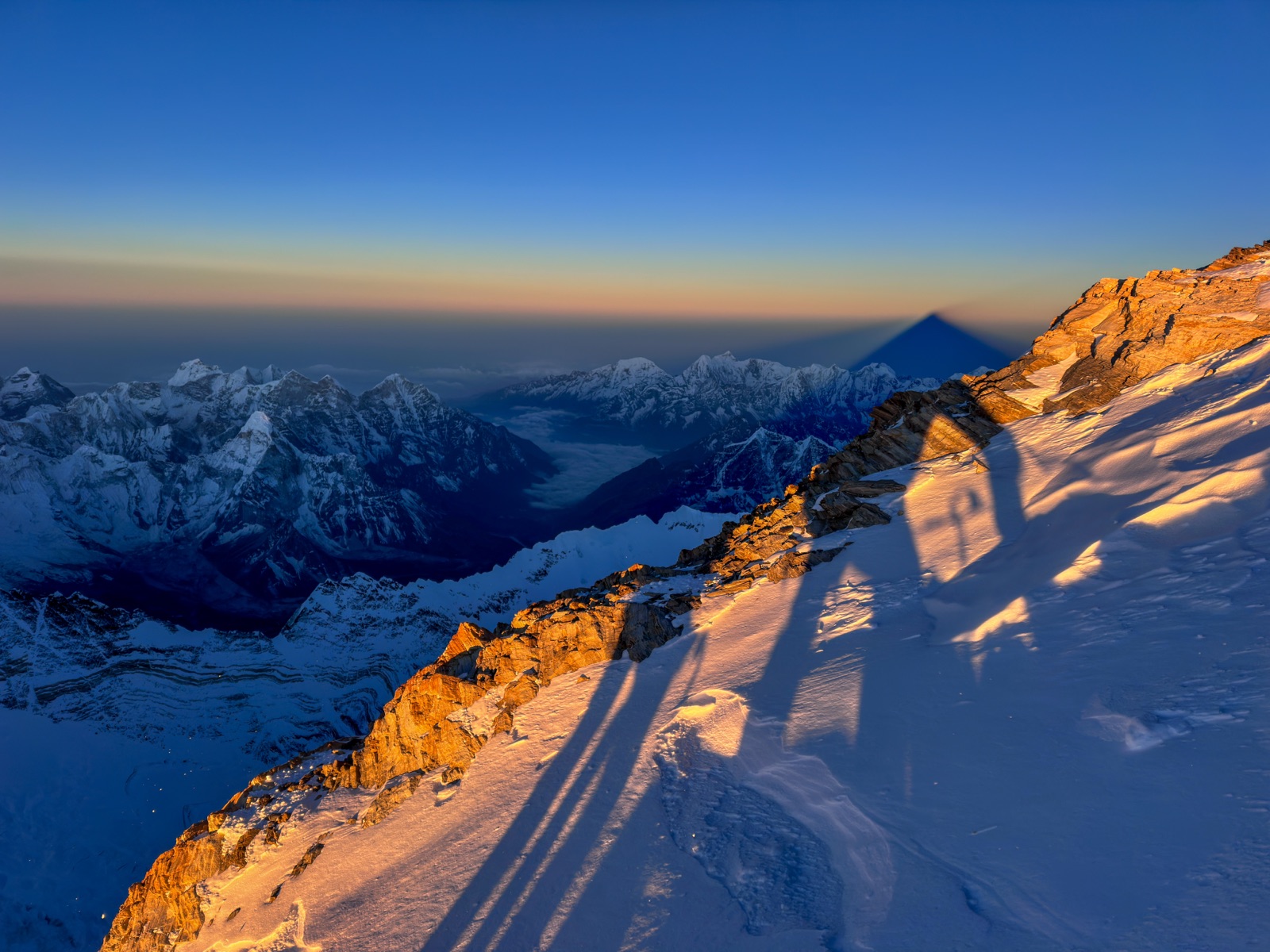 Climber on snowy ridge